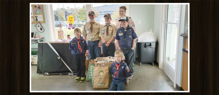 A group of scouts posing for a picture.